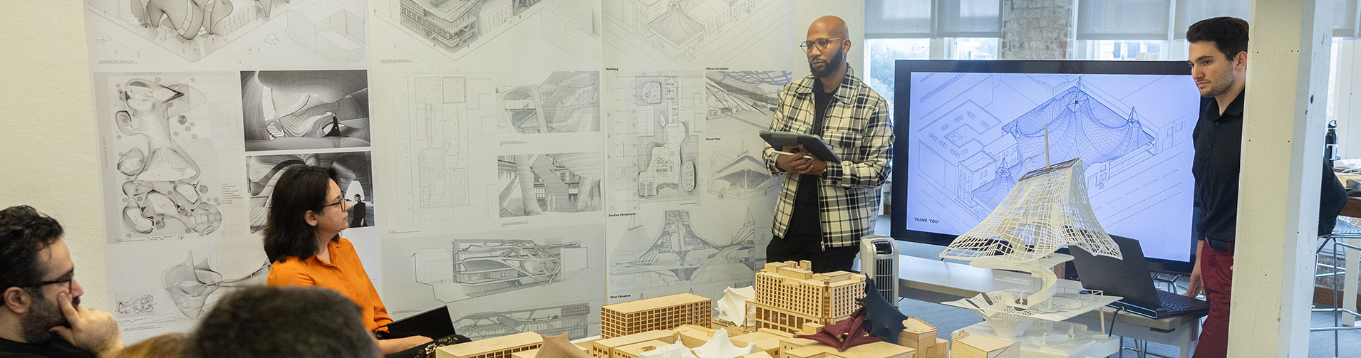 Students present their final architecture projects. 